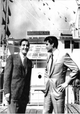 Elvis presenting Danny Thomas and St. Jude with his yacht